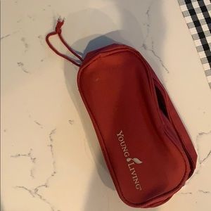 Red YOUNG LIVING travel bag